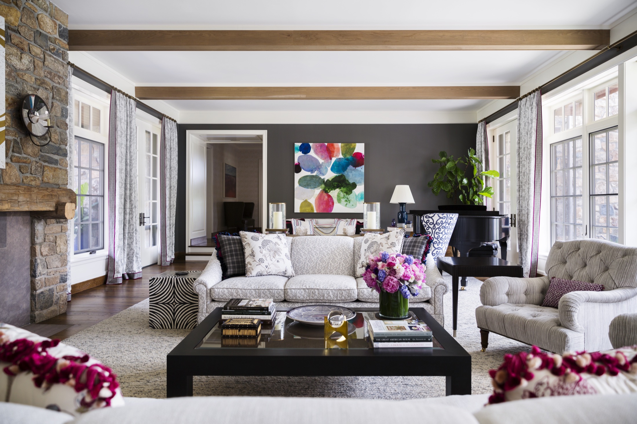 A serene white gallery interior with wide oak floors