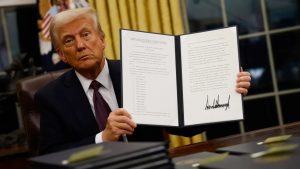 President Donald Trump with Executive Order signed