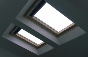 Modern minimalist skylight with natural light in a contemporary interior setting.